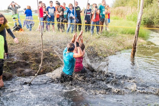 ESTARREJA, PORTUGAL - SEPTEMBER 23: Athletes go through mud and water at the Biorace on september 23, 2017 in Estarreja, Portugal.