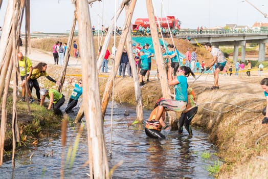 ESTARREJA, PORTUGAL - SEPTEMBER 23: Athletes go through mud and water at the Biorace on september 23, 2017 in Estarreja, Portugal.