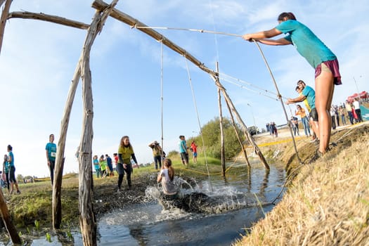ESTARREJA, PORTUGAL - SEPTEMBER 23: Athletes go through mud and water at the Biorace on september 23, 2017 in Estarreja, Portugal.