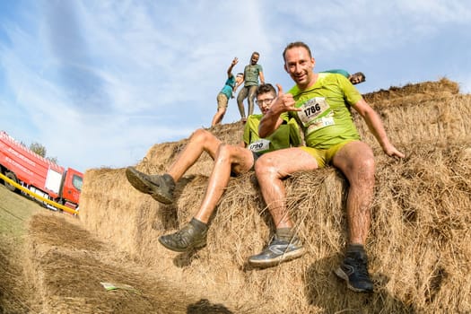 ESTARREJA, PORTUGAL - SEPTEMBER 23: Athletes overcoming the hay osbtacle at the Biorace on september 23, 2017 in Estarreja, Portugal.