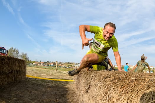 ESTARREJA, PORTUGAL - SEPTEMBER 23: Athletes overcoming the hay osbtacle at the Biorace on september 23, 2017 in Estarreja, Portugal.