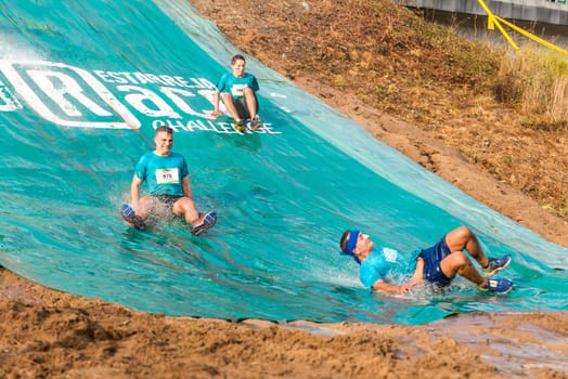 ESTARREJA, PORTUGAL - SEPTEMBER 23: Athletes sliding to mud and water at the Biorace on september 23, 2017 in Estarreja, Portugal.