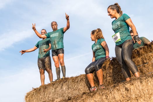 ESTARREJA, PORTUGAL - SEPTEMBER 23: Athletes overcoming the hay osbtacle at the Biorace on september 23, 2017 in Estarreja, Portugal.