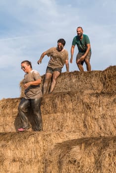 ESTARREJA, PORTUGAL - SEPTEMBER 23: Athletes overcoming the hay osbtacle at the Biorace on september 23, 2017 in Estarreja, Portugal.