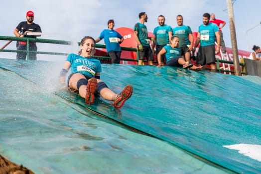 ESTARREJA, PORTUGAL - SEPTEMBER 23: Athletes sliding to mud and water at the Biorace on september 23, 2017 in Estarreja, Portugal.