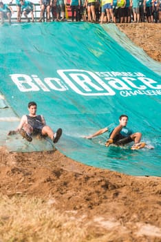 ESTARREJA, PORTUGAL - SEPTEMBER 23: Athletes sliding to mud and water at the Biorace on september 23, 2017 in Estarreja, Portugal.