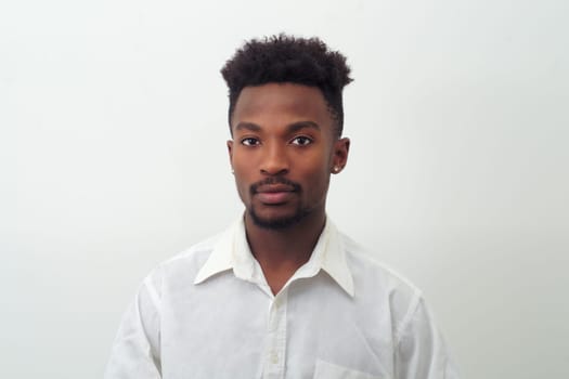 young man portrait in white shirt on white background