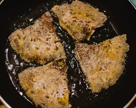 mushroom chops from macrolepiota procera on a pan