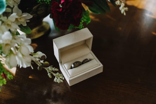 close up on wedding rings on the table