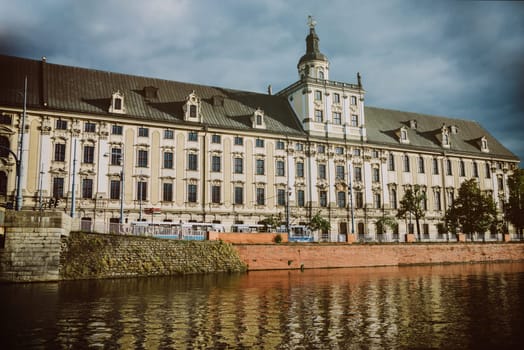 close up on university building in wroclaw,view from the river