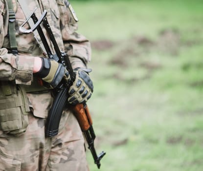 close up on soldier with machine gun