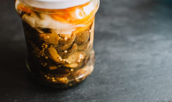 marinated mushrooms,bay bolete (imleria badia) in jar