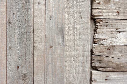 Texture of an old tree. Weathered pieces of wood, with rusty nails. Old tree background.