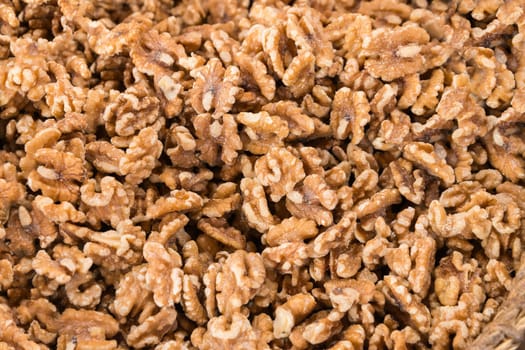 Close up shelled walnuts on market. top view