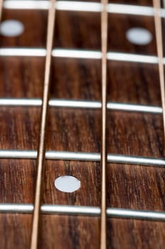 Acoustic Bass Guitar Fretboard Close Up.