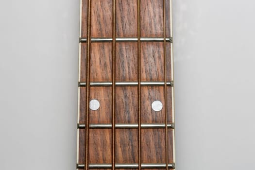 Acoustic Bass Guitar Fretboard Close Up.