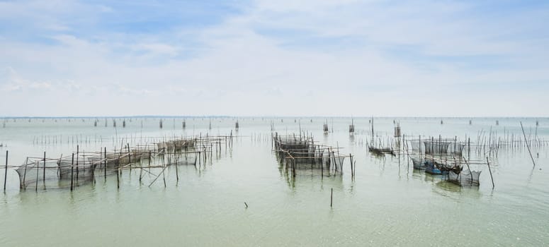 Fish farming in the sea with cages for rearing fish in Thailand