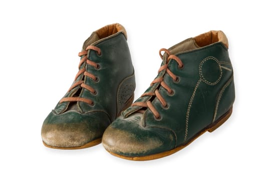 Old baby shoes exposed on a light background
