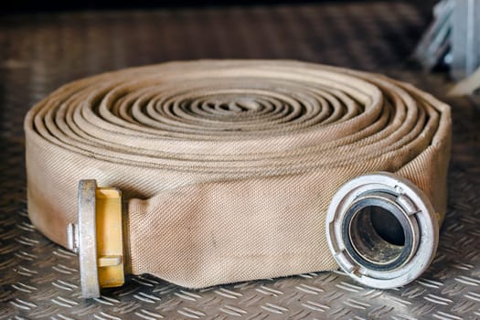 Rolled up fire hose in detail