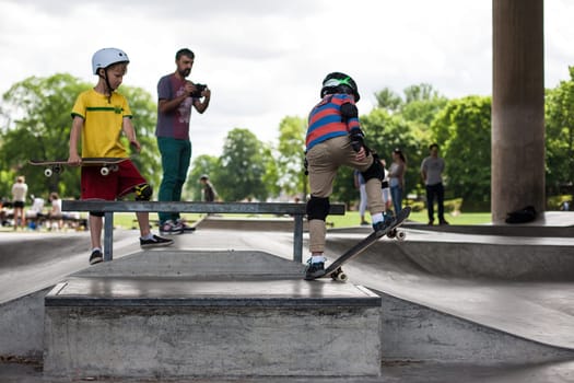 Stockholm, Sweden - July 11, 2017 : Powerful funny young guys are trained in a skate park. Leisure, playing, trick