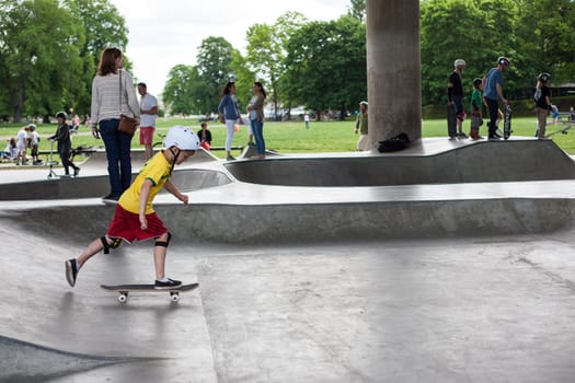 Stockholm, Sweden - July 11, 2017 : Powerful funny young guys are trained in a skate park. Leisure, playing, trick