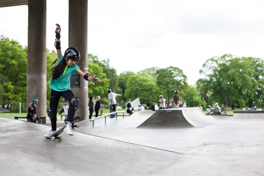 Stockholm, Sweden - July 11, 2017 : Powerful funny young guys are trained in a skate park. Leisure, playing, trick