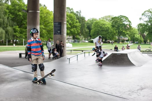 Stockholm, Sweden - July 11, 2017 : Powerful funny young guys are trained in a skate park. Leisure, playing, trick