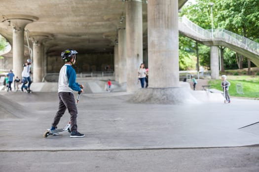 Powerful funny young guys are trained in a skate park Stockholm, Sweden. Leisure, playing, trick