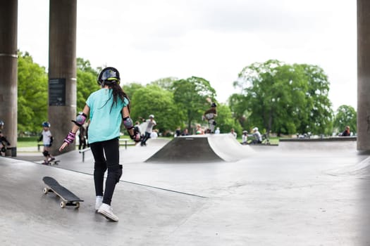 Powerful funny young guys are trained in a skate park Stockholm, Sweden. Leisure, playing, trick
