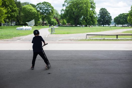Powerful funny young guys are trained in a skate park Stockholm, Sweden. Leisure, playing, trick