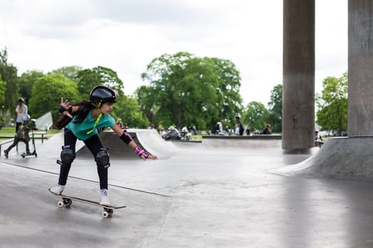 Stockholm, Sweden - July 11, 2017 : Powerful funny young guys are trained in a skate park. Leisure, playing, trick