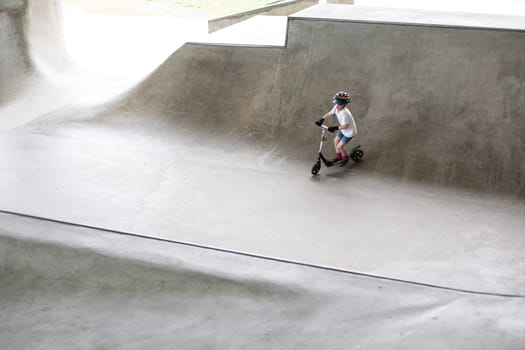 Powerful funny young guys are trained in a skate park Stockholm, Sweden. Leisure, playing, trick