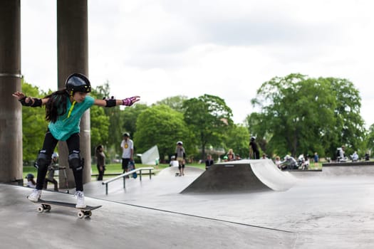Stockholm, Sweden - July 11, 2017 : Powerful funny young guys are trained in a skate park. Leisure, playing, trick