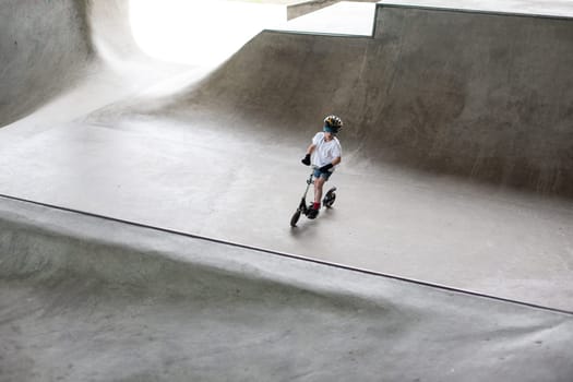 Powerful funny young guys are trained in a skate park Stockholm, Sweden. Leisure, playing, trick