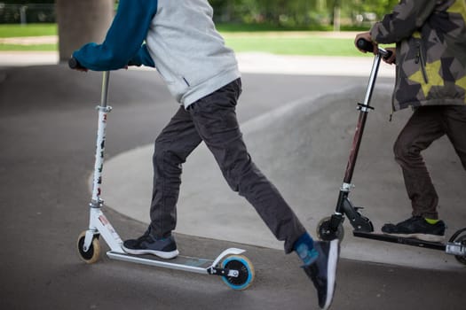 Powerful funny young guys are trained in a skate park Stockholm, Sweden. Leisure, playing, trick