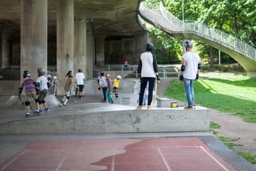 Powerful funny young guys are trained in a skate park Stockholm, Sweden. Leisure, playing, trick