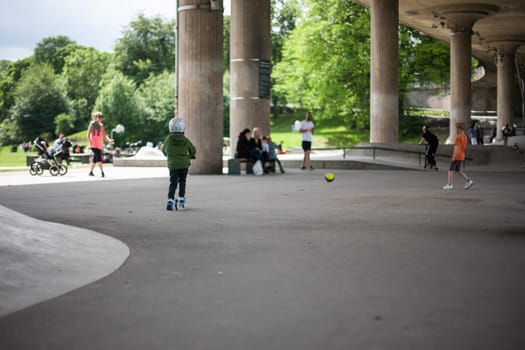 Powerful funny young guys are trained in a skate park Stockholm, Sweden. Leisure, playing, trick