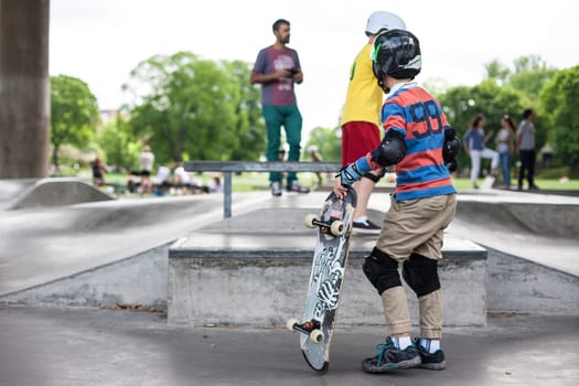 Powerful funny young guys are trained in a skate park Stockholm, Sweden. Leisure, playing, trick