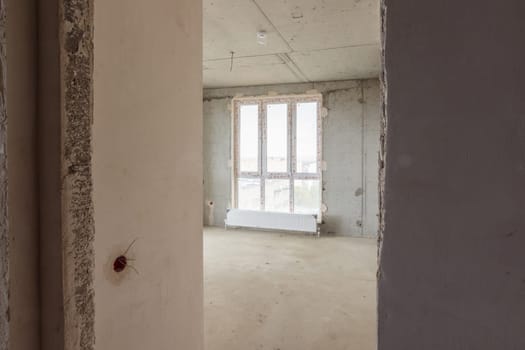 Entrance to the room with a stained-glass window in a new building