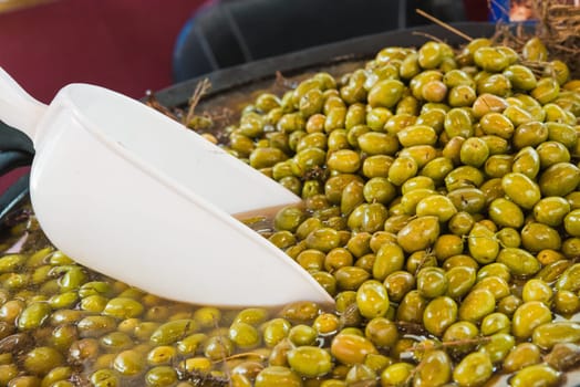 Delicious green olives in the market. Olives from Jaen