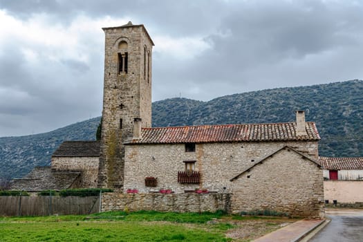 Virgen del Rosario Church in the rural town of Triste Aragon, Spain. Its Romanesque tower from the beginning of the XIII century