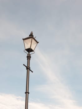 black outside street lamp with blue and cloud sky  Essex  England  UK