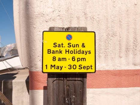 close up orange parking sign outside sunny day   essex  england  UK