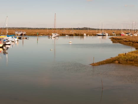 open water in front of dock harbour marsh land  essex  england  UK