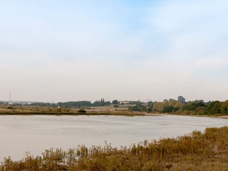 river stream scene autumn empty coast outside water sea  Essex  England  UK