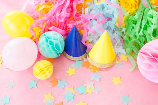 Colorful decoration,confetti for a party on a pink background