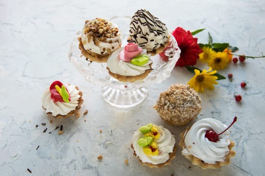 Different cakes composition on concrete background