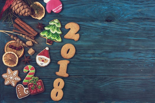 Gingerbreads for new 2017 year on wooden background, xmas theme