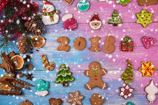 Gingerbreads for new 2017 year on wooden background, xmas theme