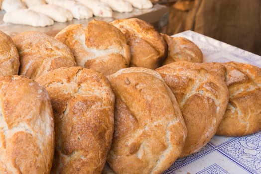 Rustic bread loaves on a market stall, Badajoz